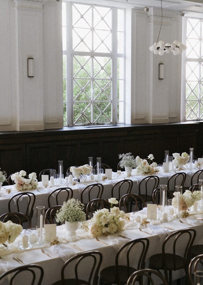 White florals, and white linen line the table at The Trust